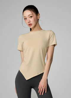 XEXYMIX Ice Feather Light 2.0 Asymmetric Shirring Short Sleeve Top in Ginger Beige — image 1
